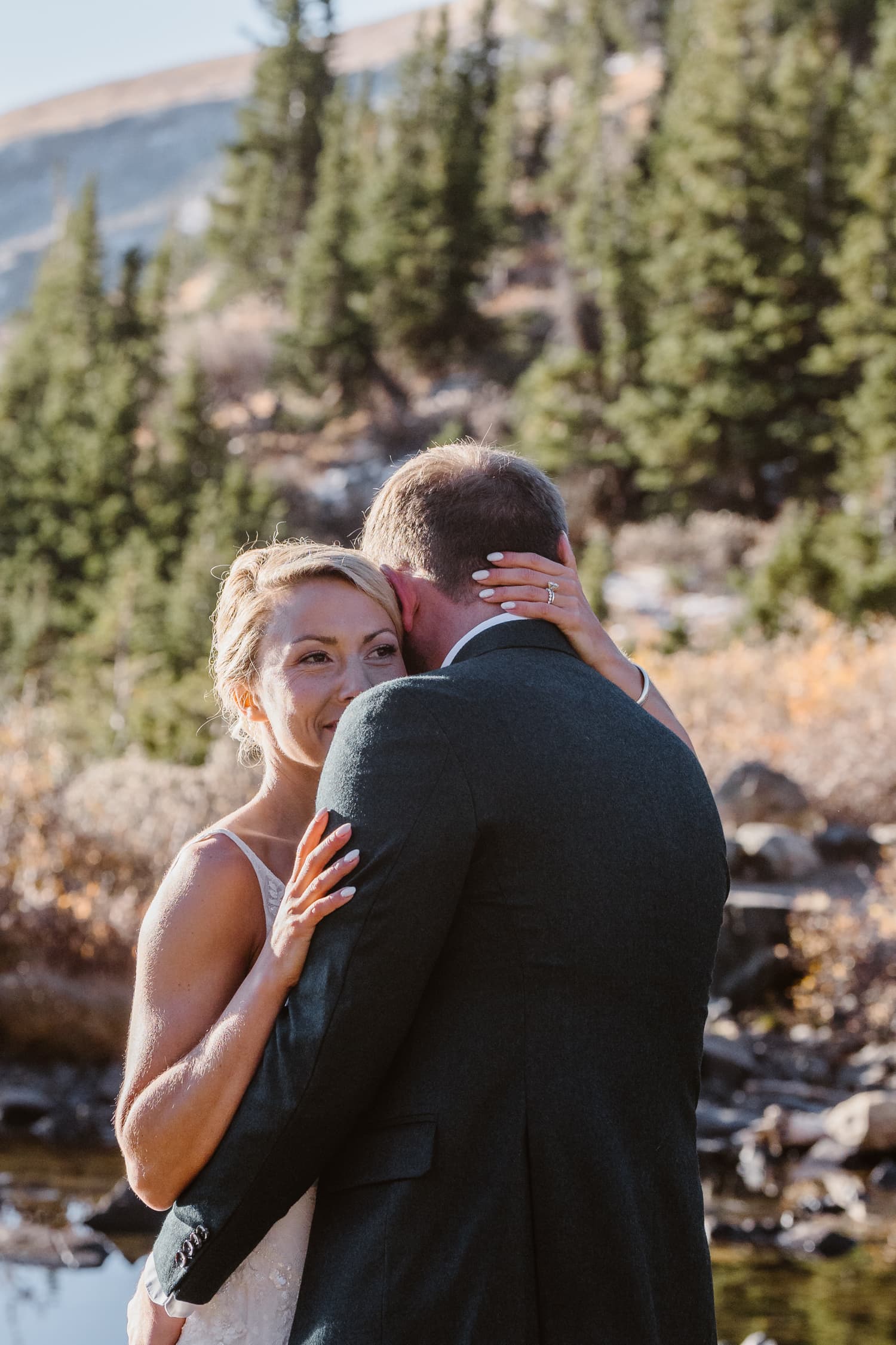 Couple having intimate moment at their Breckenridge elopement.