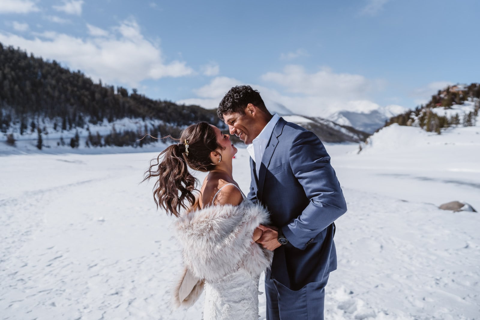 Couple sharing a kiss after their first look at their Breckenridge elopement.