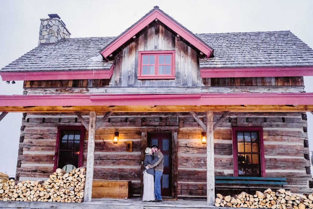 Couple standing on a deck for their airbnb elopement.