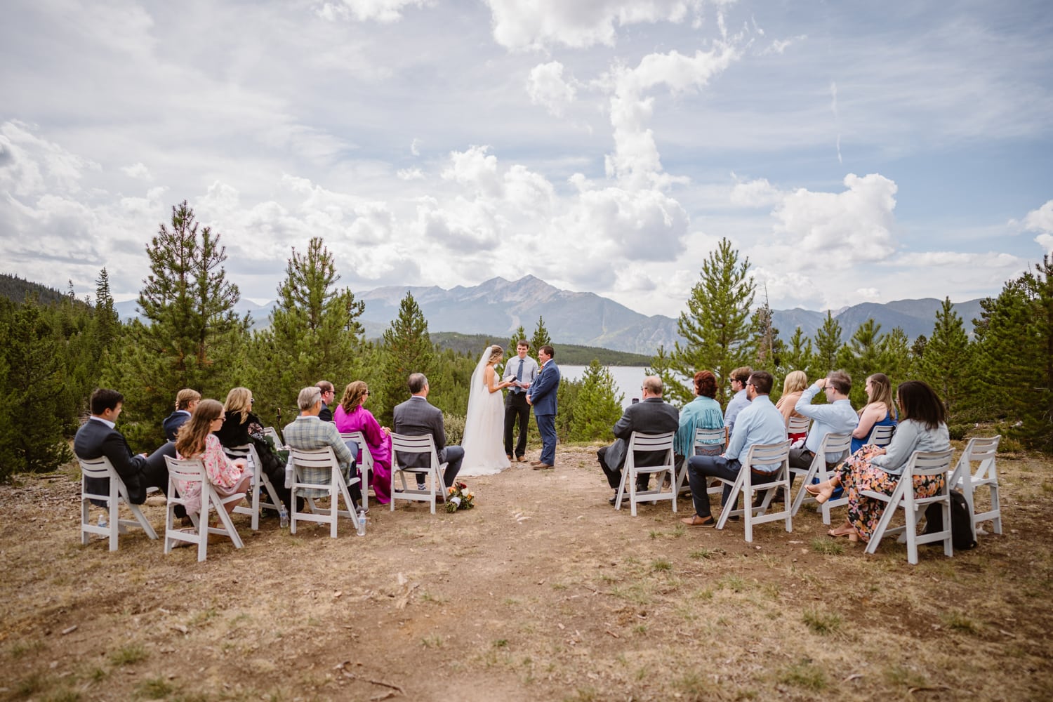 A couple sharing their vows with their families at Windy Point Campground in Breckenridge, Colorado.