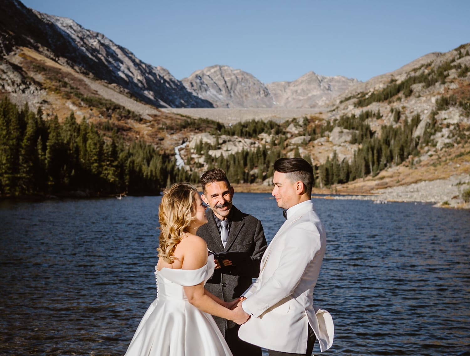 Officiant starting an elopement ceremony during the spring Colorado elopement.