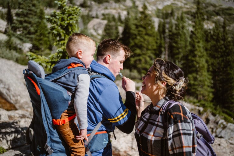 Family sharing a drink from their camelback on their Colorado elopement.
