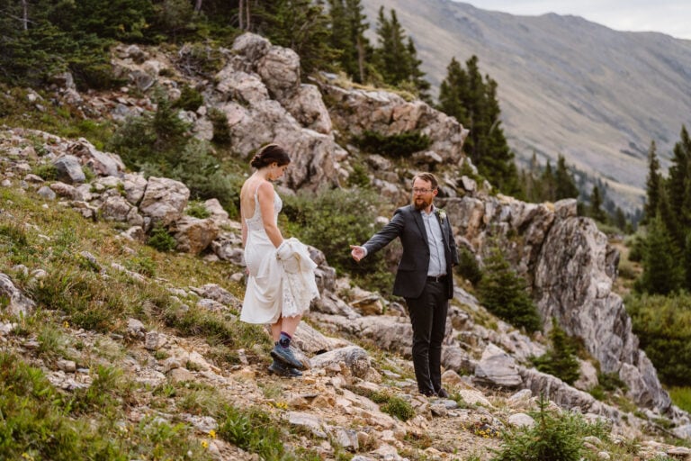 Couple hiking down the mountain for their Colorado elopement.