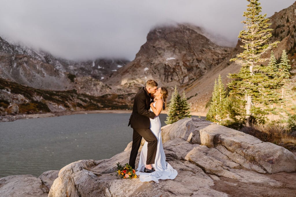 Couple sharing a kiss for their Lake Isabelle elopement.
