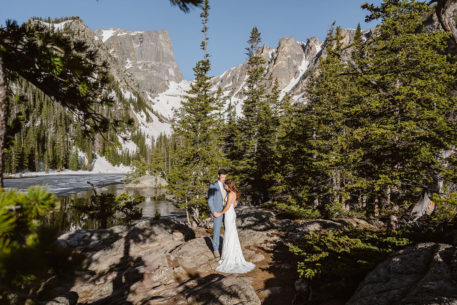 Bride and groom at Dream Lake for their Rocky Mountain National Park elopement.
