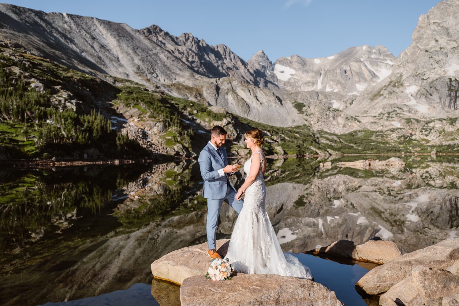 Couple sharing their vows at their Rocky Mountain National Park elopement.