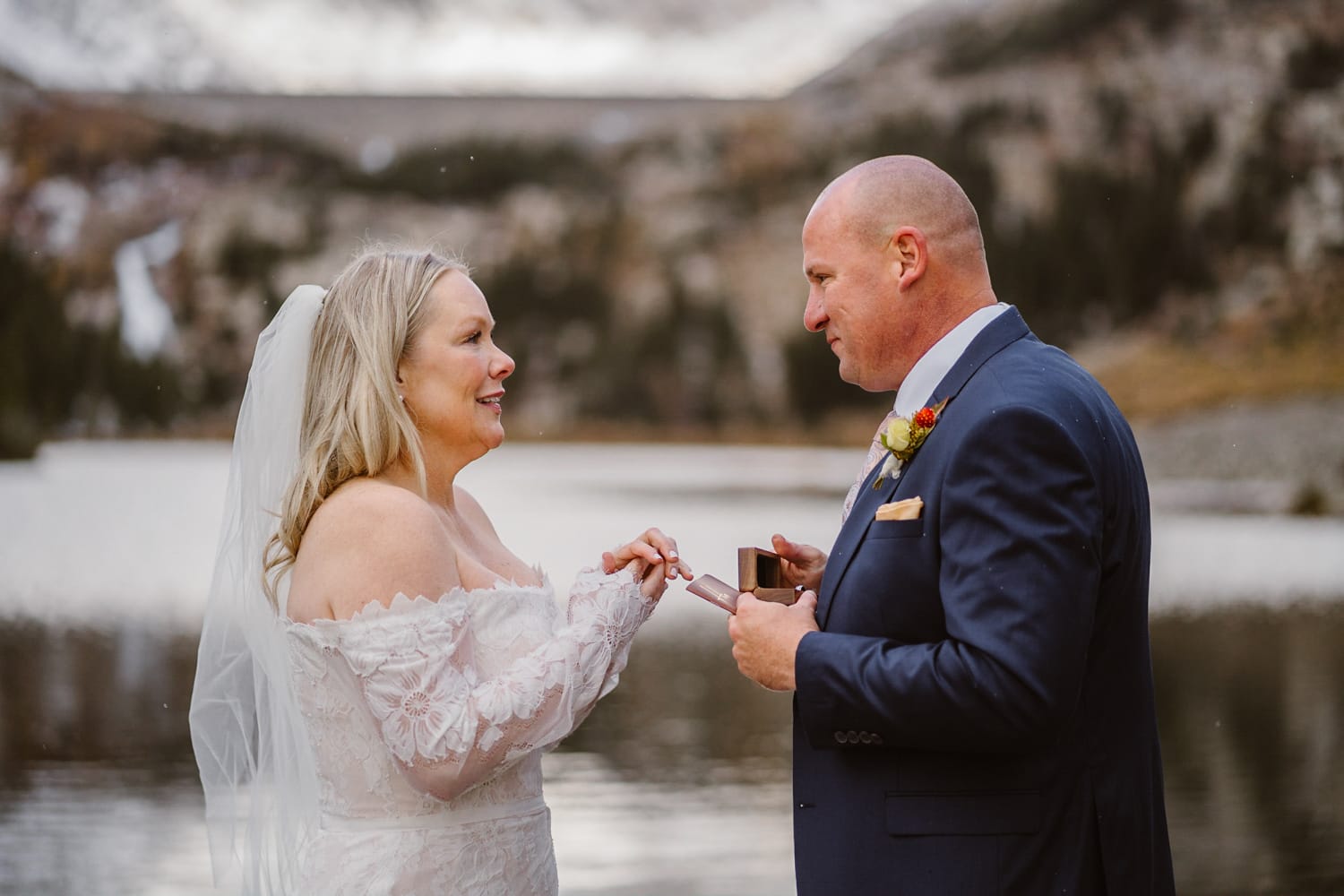 Couple sharing rings after their Self-Solemnization elopement in Colorado.