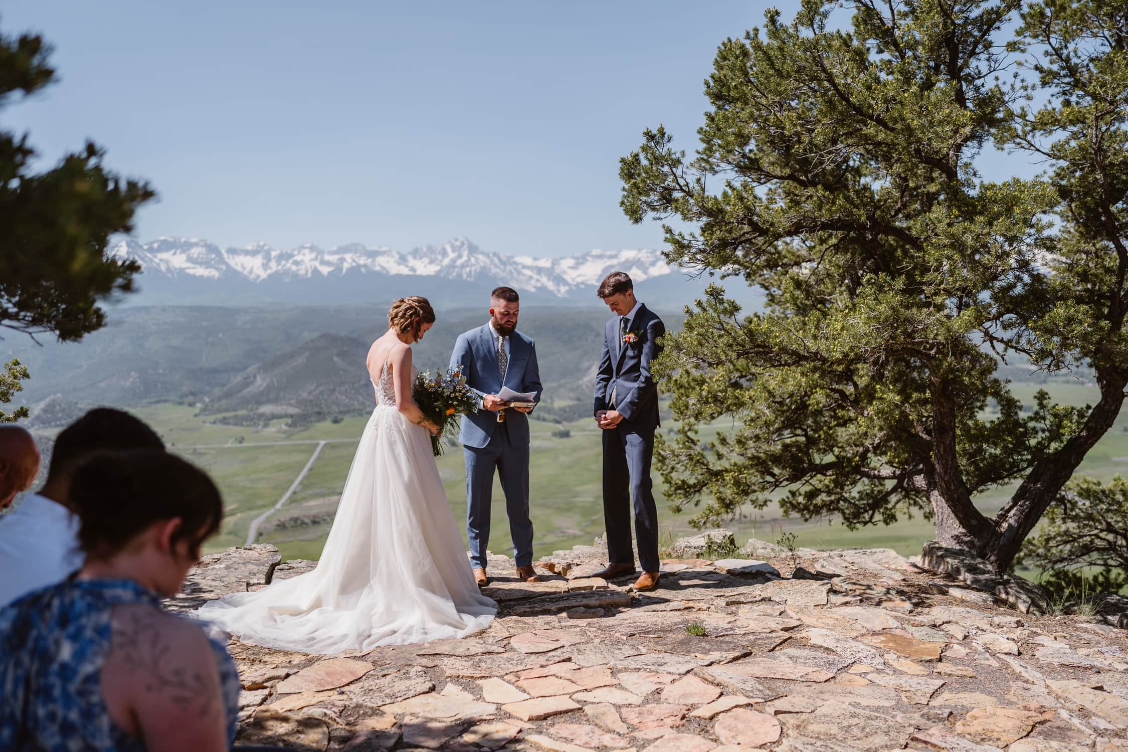 Couple sharing their vows at a home for their Telluride elopement.