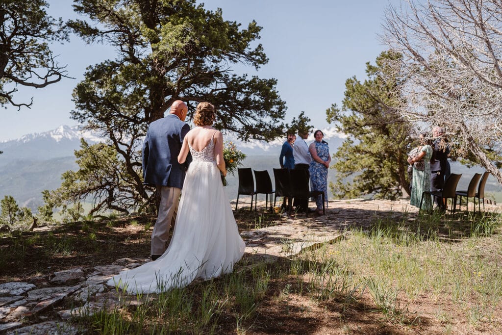 Father daughter walking down the aisle at their Airbnb elopement.