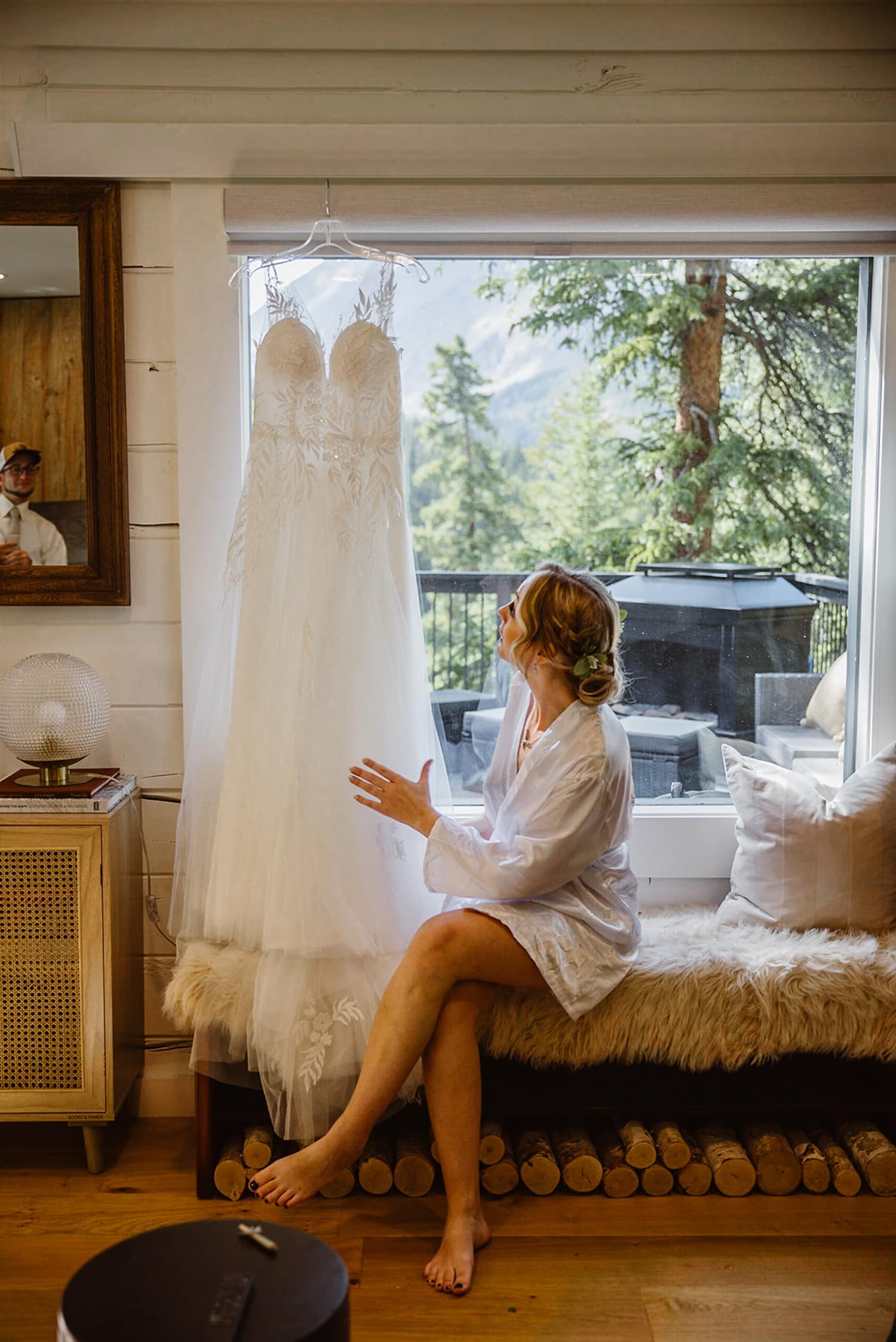Bride getting ready at her airbnb elopement.