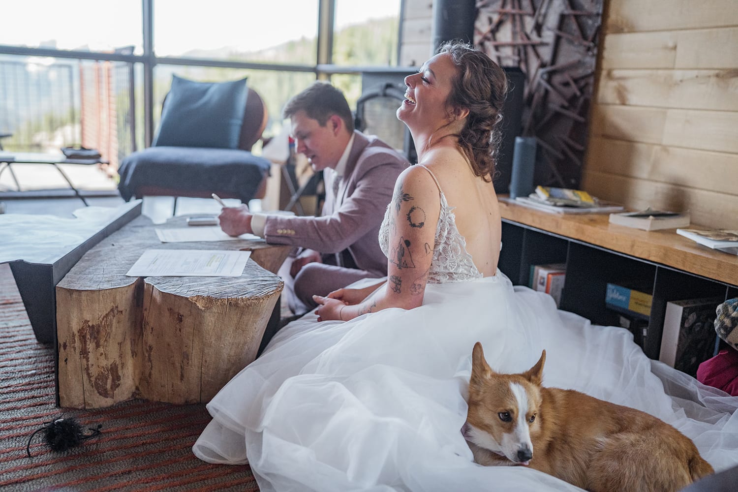 Bride and groom signing their marriage license at their airbnb elopement.