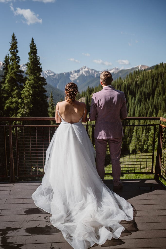 Couple on a deck at their airbnb elopement.