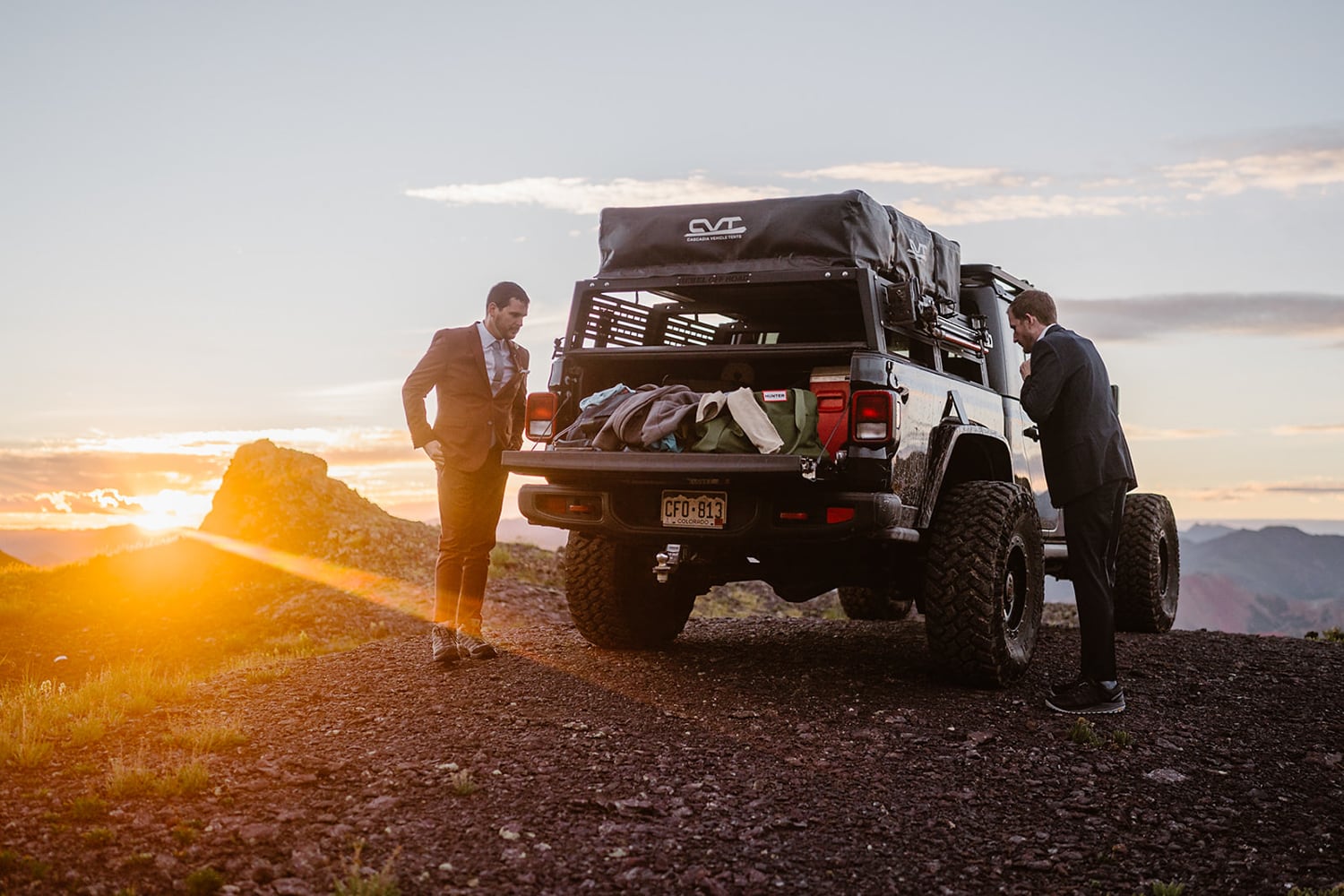 Two grooms getting ready at their off roading elopement.