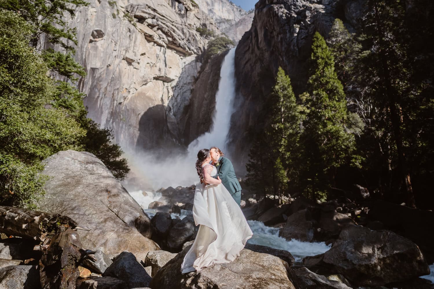 Couple sharing a kiss near Yosemite Falls.