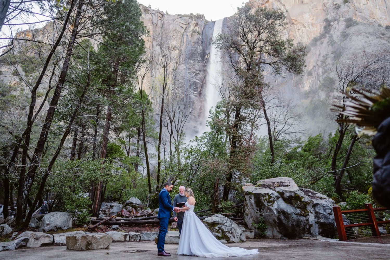 Couple getting married at Bridal Veil Falls in Yosemite.