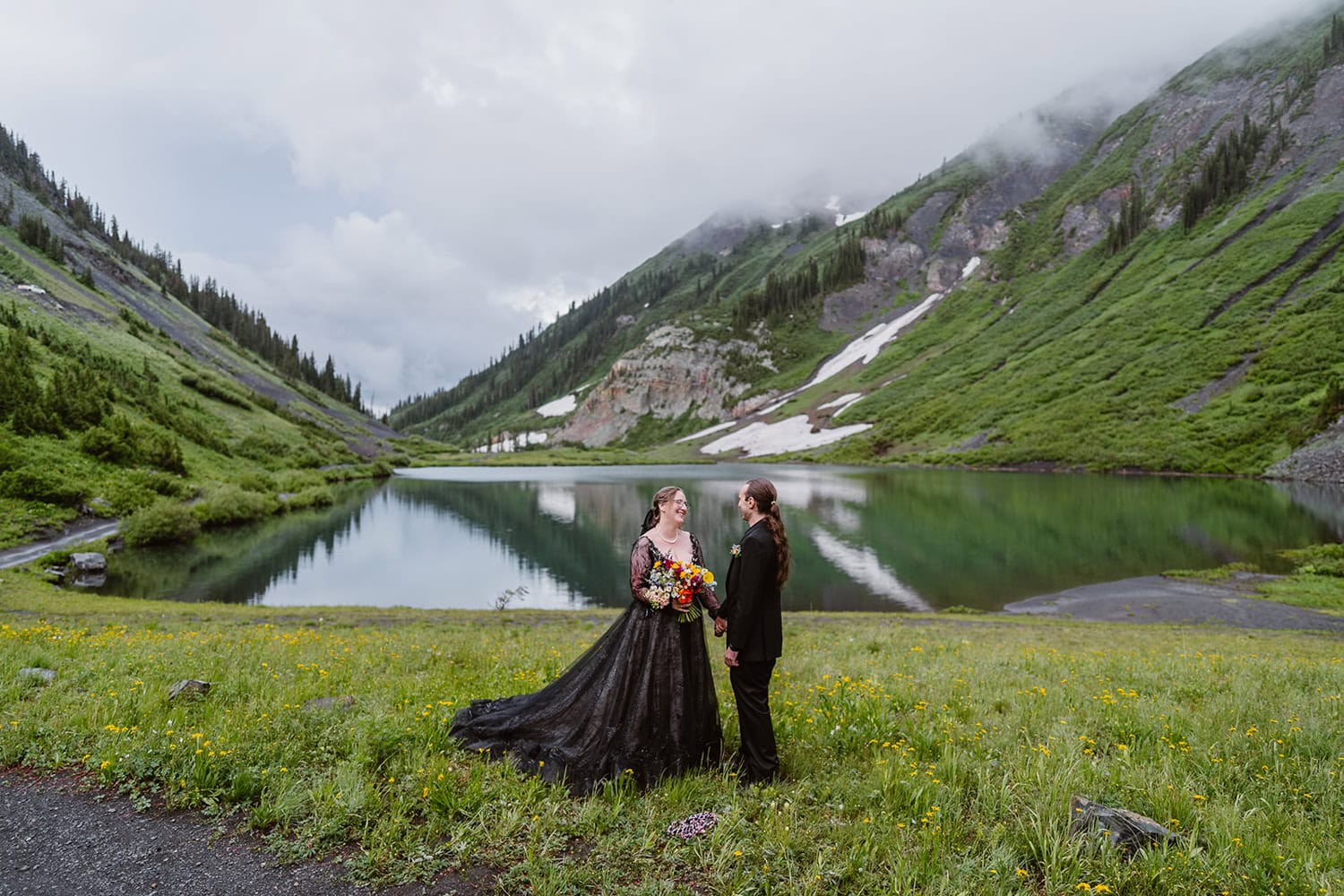 Bride and groom with their flowers In Crested Butte for their elopement.